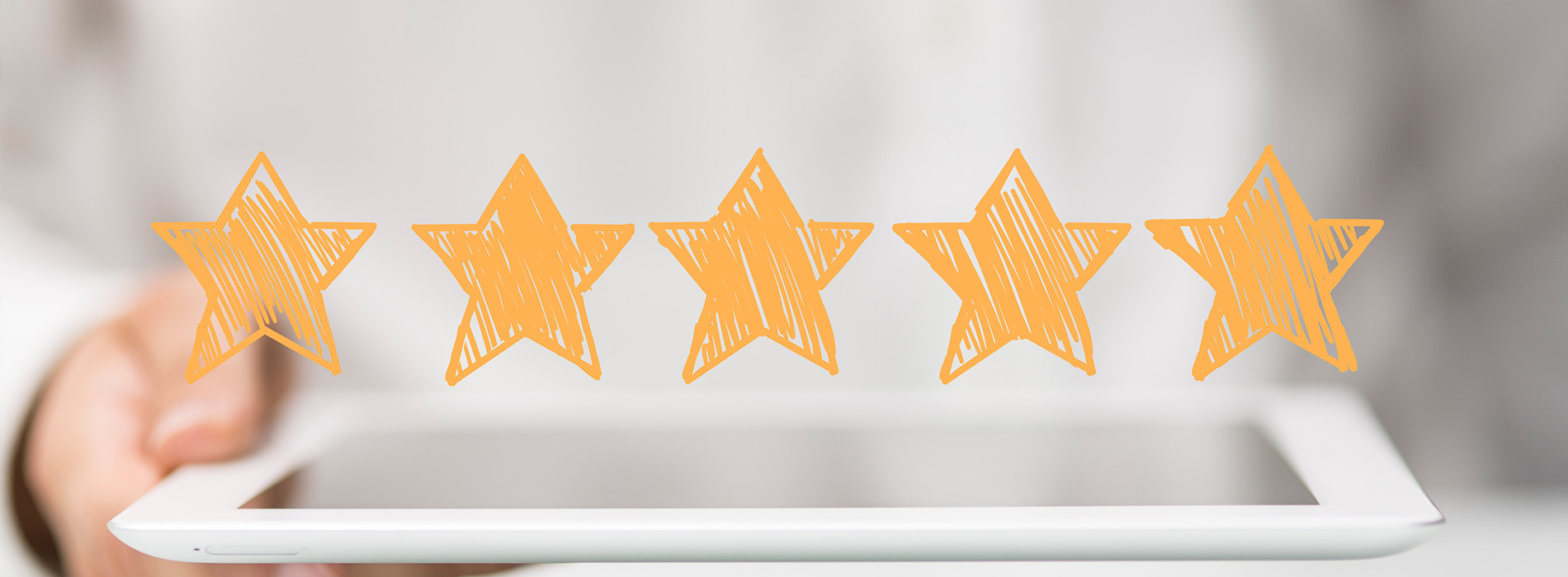 The image depicts a tablet with an overlay of four orange stars and a textured background.